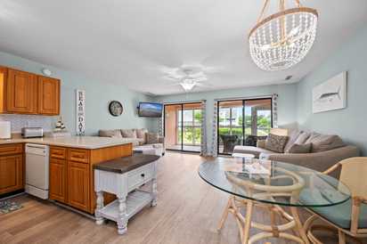 Step into your light-filled coastal retreat, where soft blues and sandy neutrals create a calming atmosphere. Gather around the cozy living space, catch up over coffee at the dining table, or step through sliding doors to your private balcony with scenic v